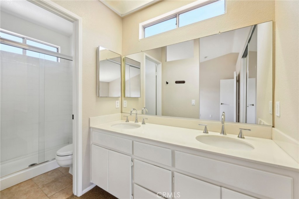 26658 Caravan Circle Corona, CA 92883 - Photo 24 of 50 a bathroom with a sink and a mirror