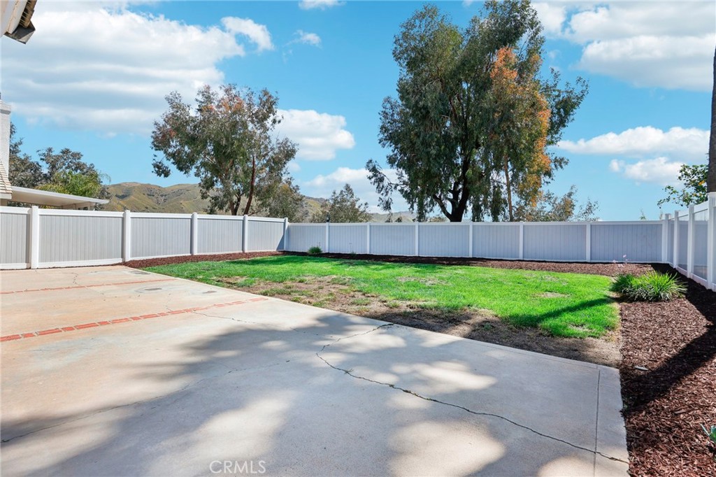 26658 Caravan Circle Corona, CA 92883 - Photo 34 of 50 a view of a yard with a house