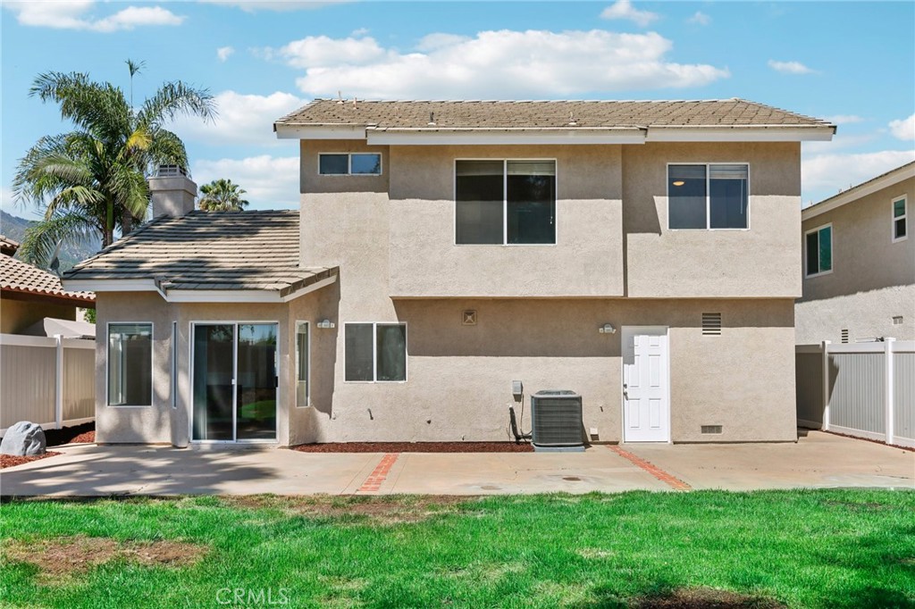 26658 Caravan Circle Corona, CA 92883 - Photo 37 of 50 a front view of a house with a yard and garage
