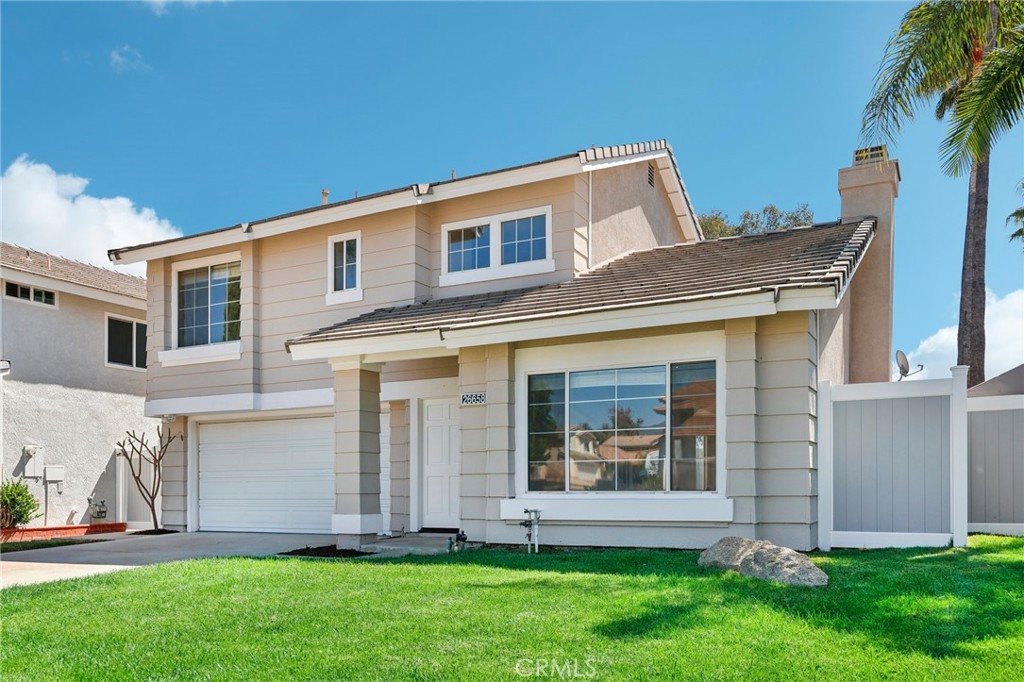 26658 Caravan Circle Corona, CA 92883 - Photo 4 of 50 a brick house with a large windows