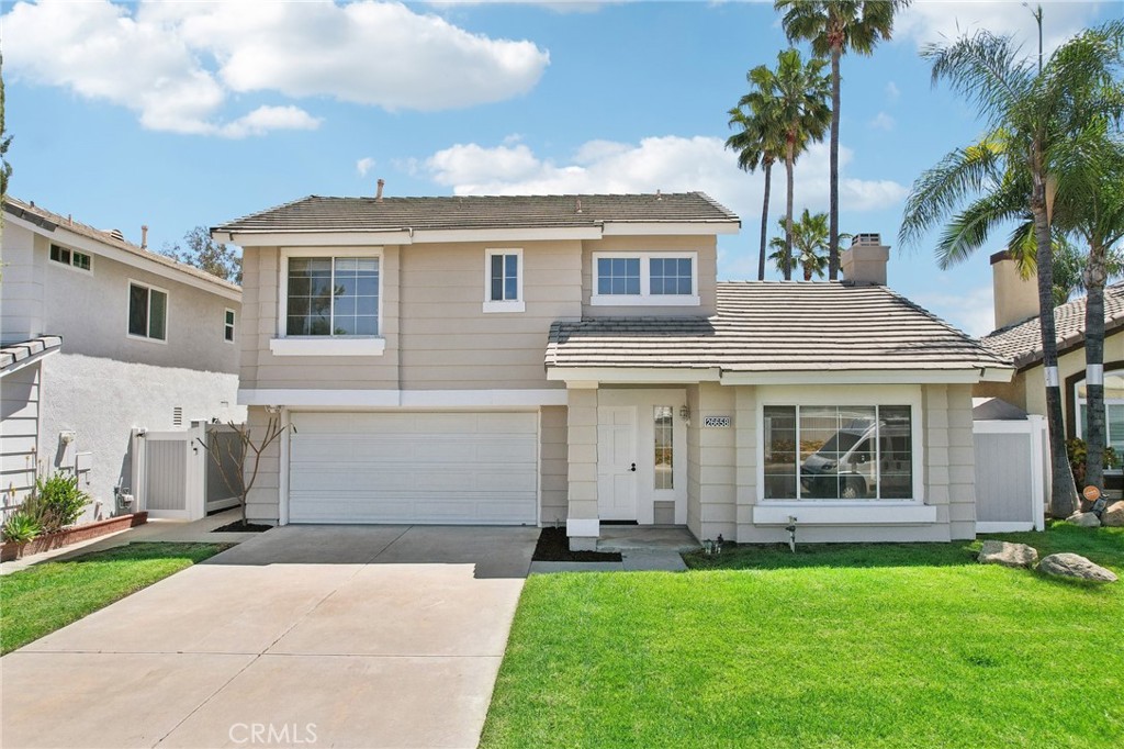 26658 Caravan Circle Corona, CA 92883 - Photo 5 of 50 front view of a house with a yard