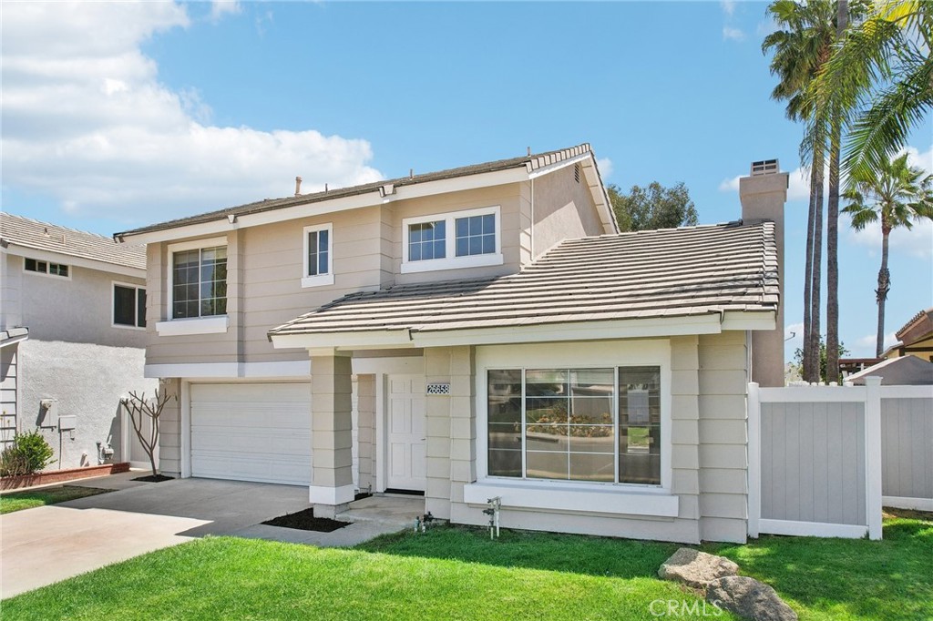 26658 Caravan Circle Corona, CA 92883 - Photo 8 of 50 front view of a house with a yard