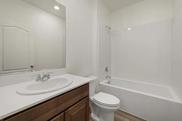a bathroom with a sink toilet and a bathtub