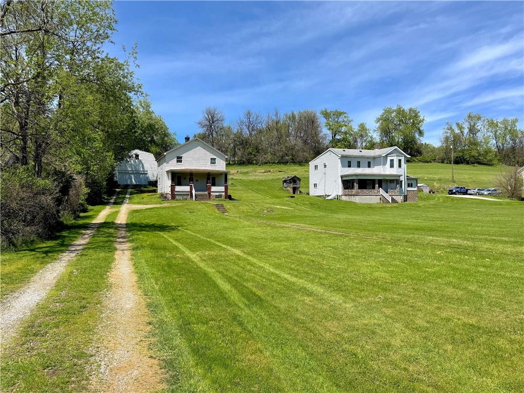 3003 Riverside Drive Claridge, PA 15623 - Photo 2 of 28 a swimming pool with outdoor seating and yard