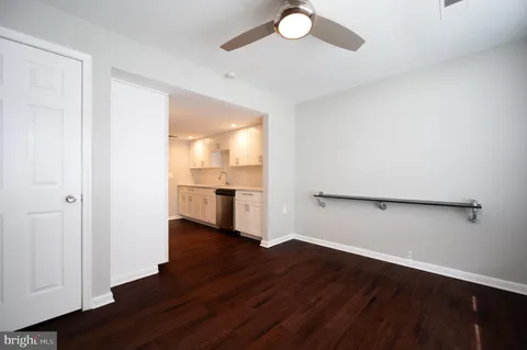 a view of a kitchen with wooden floor