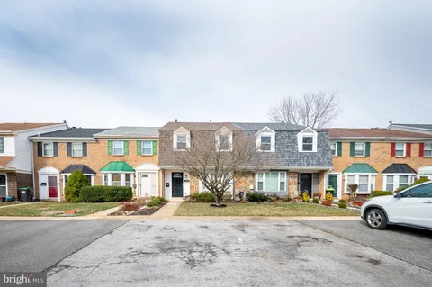 a front view of residential houses with street