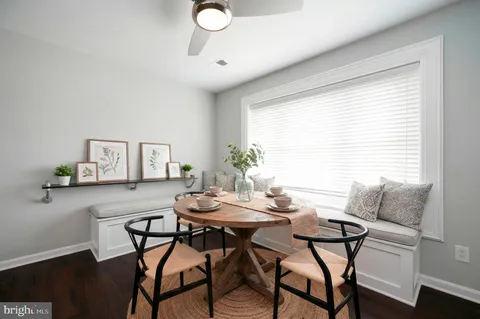 a view of a dining room with furniture and window