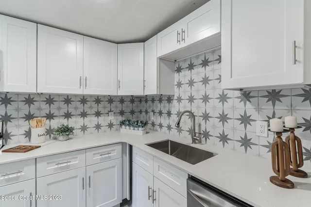 a kitchen with a sink and cabinets
