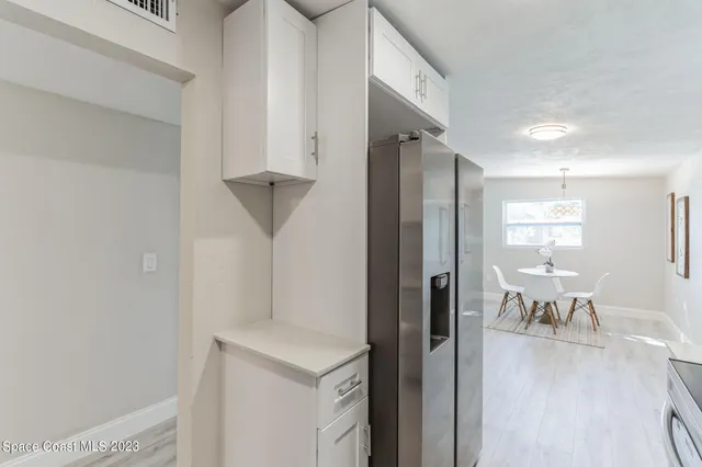 a kitchen with a stove and a microwave