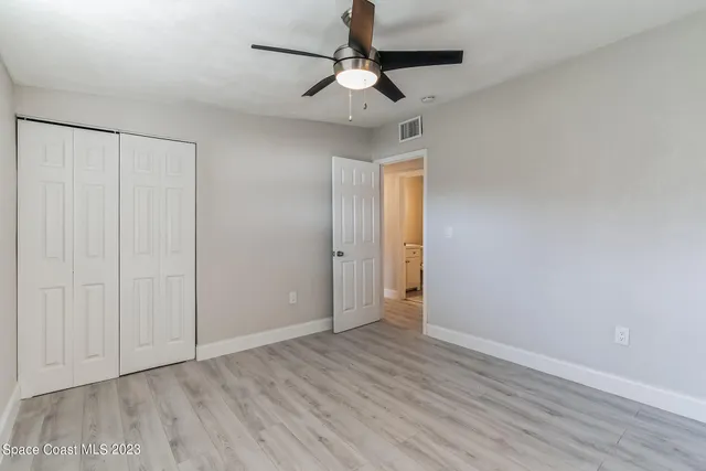 a bathroom with a shower and toilet