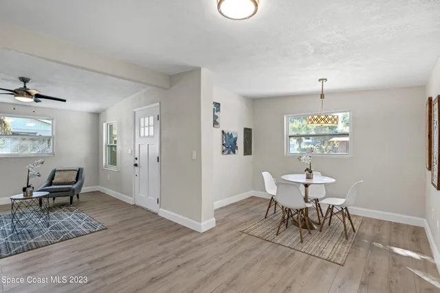 a view of an empty room and a window