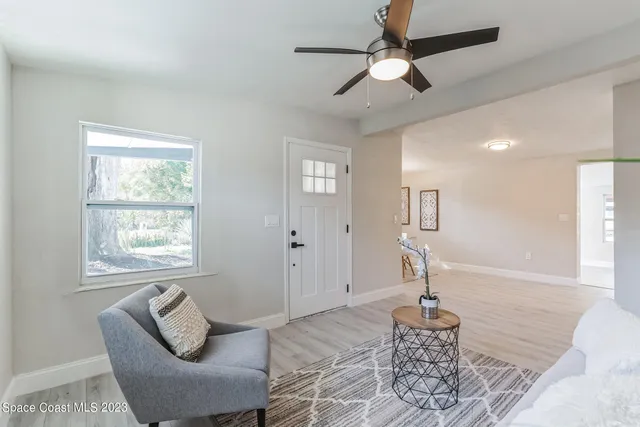 a living room with furniture and a window