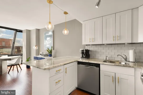 a kitchen with sink cabinets and window