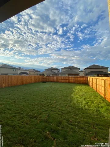 a view of a water fountain and an outdoor seating