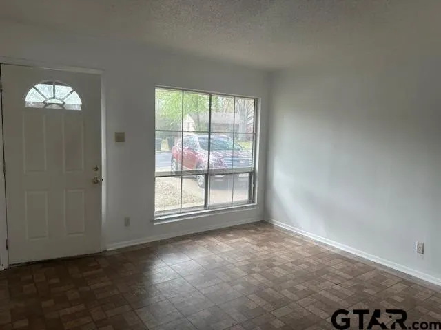 an empty room with windows