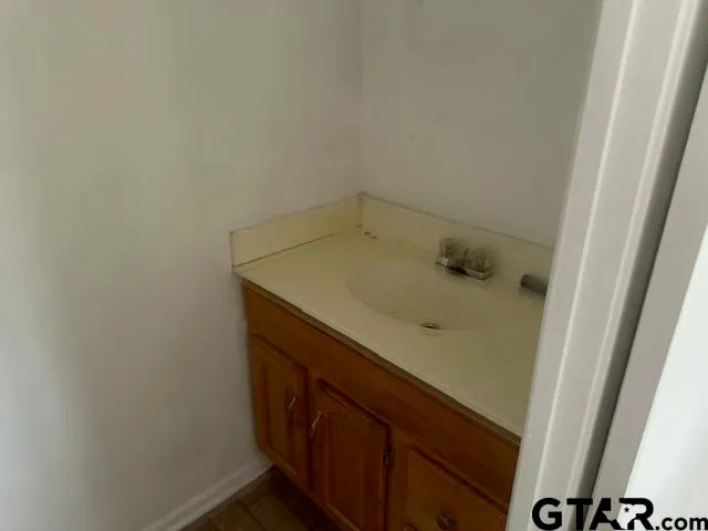 a bathroom with a sink and vanity
