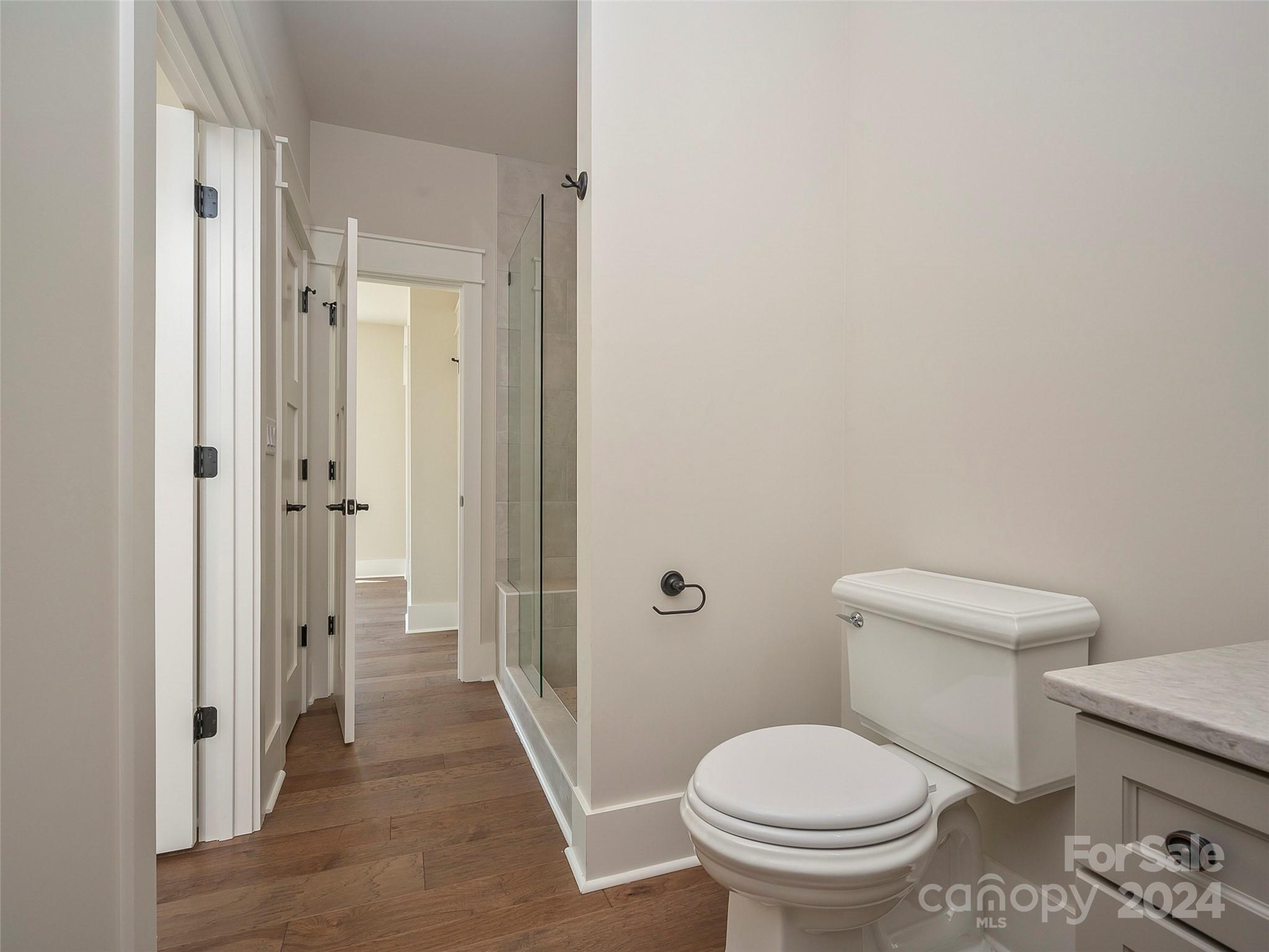 87 Jackson Ridge Ln Mill Spring, Unit 4 Mill Spring, NC 28756 - Photo 14 of 48 a bathroom with a toilet and a shower