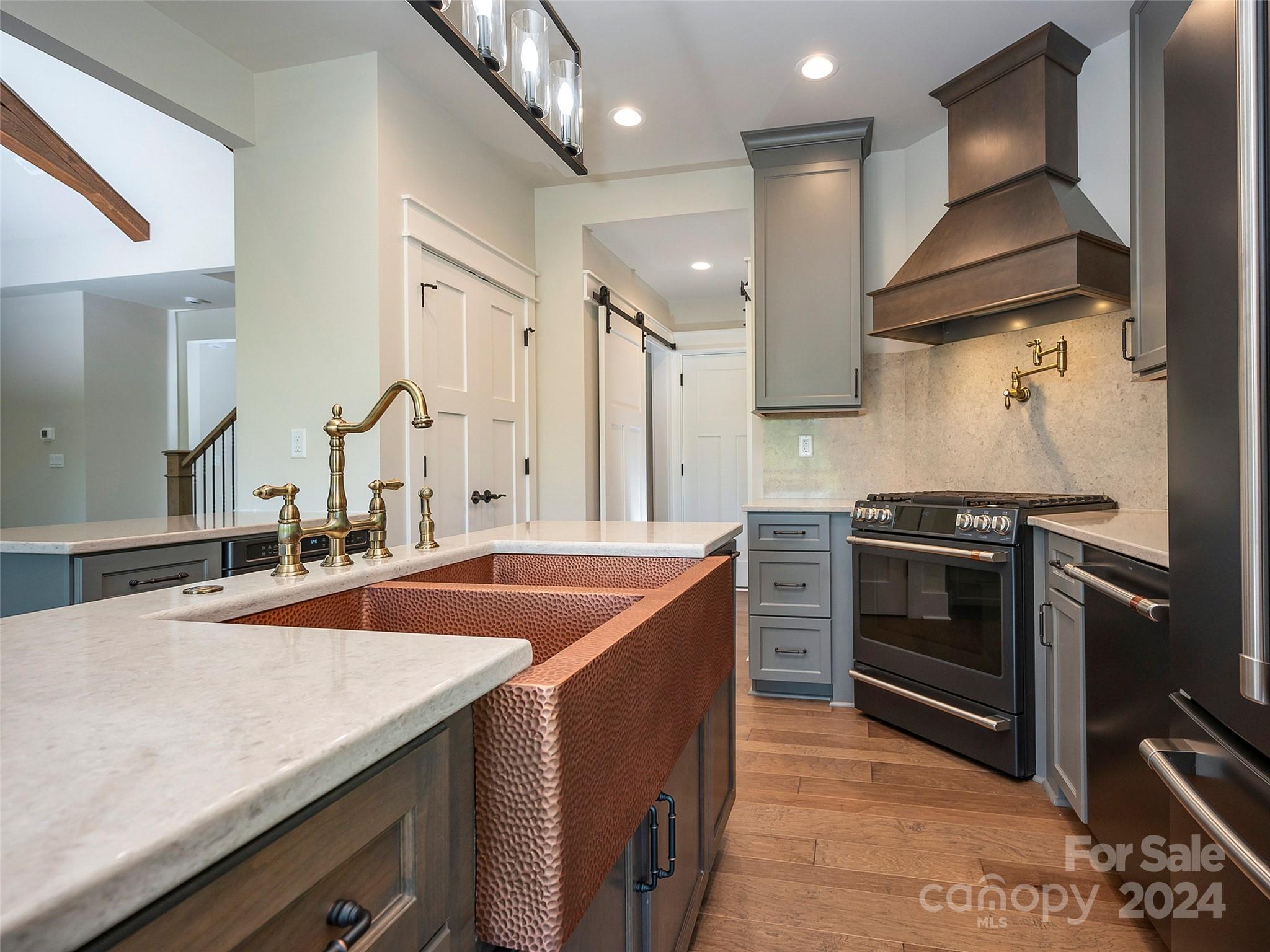 87 Jackson Ridge Ln Mill Spring, Unit 4 Mill Spring, NC 28756 - Photo 22 of 48 a kitchen with stainless steel appliances granite countertop a sink and a stove