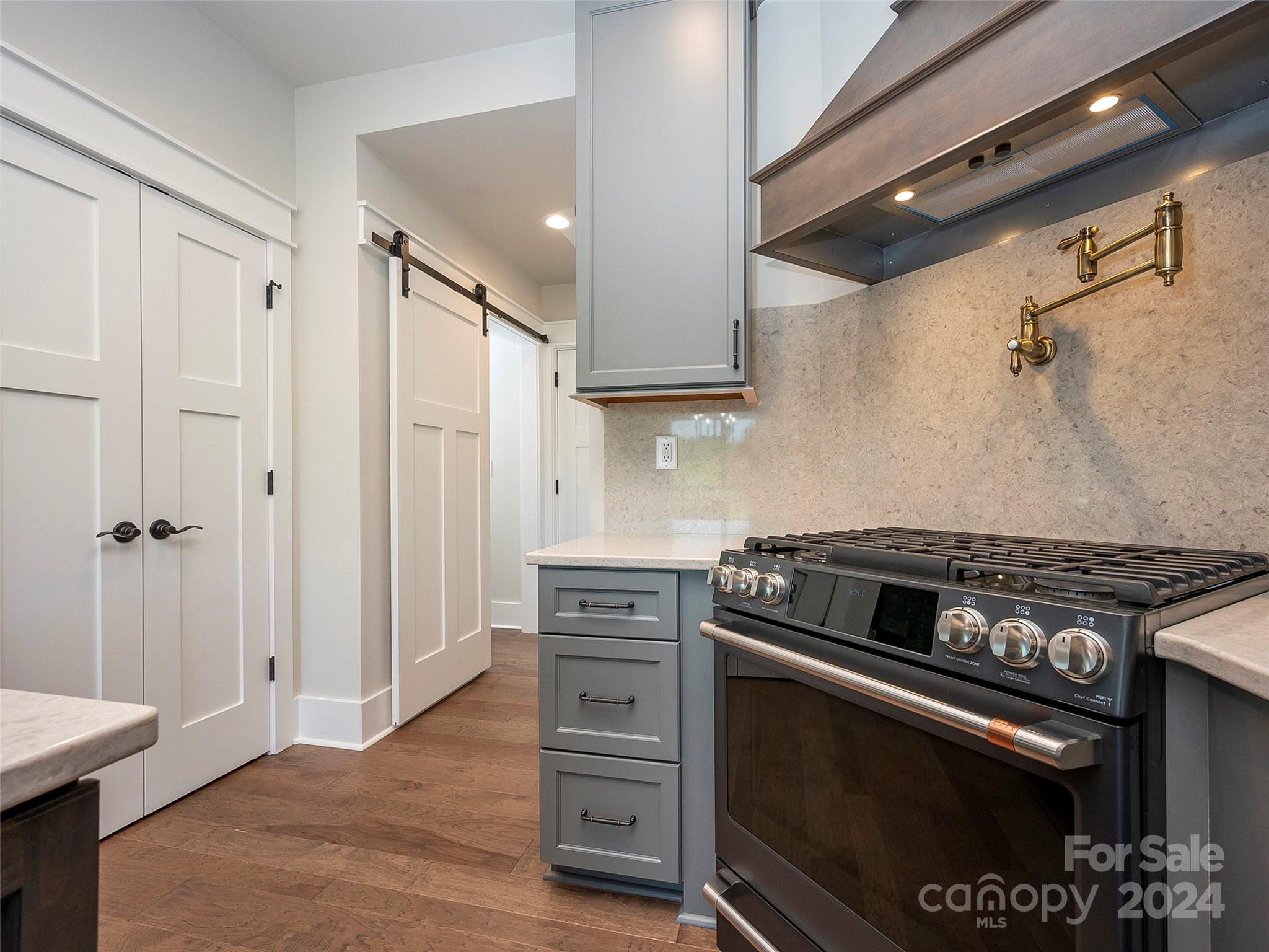87 Jackson Ridge Ln Mill Spring, Unit 4 Mill Spring, NC 28756 - Photo 23 of 48 a kitchen with stainless steel appliances granite countertop a stove and a refrigerator