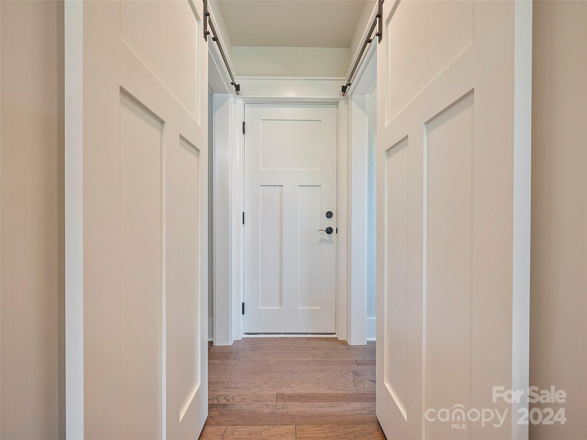 87 Jackson Ridge Ln Mill Spring, Unit 4 Mill Spring, NC 28756 - Photo 25 of 48 a view of a hallway with wooden floor and closet