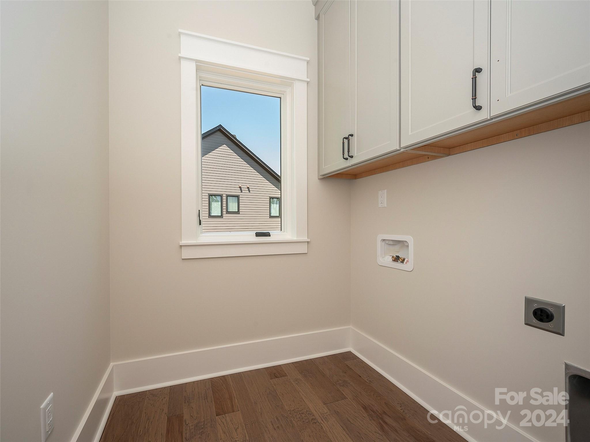 87 Jackson Ridge Ln Mill Spring, Unit 4 Mill Spring, NC 28756 - Photo 26 of 48 a view of storage and utility room with wooden floor