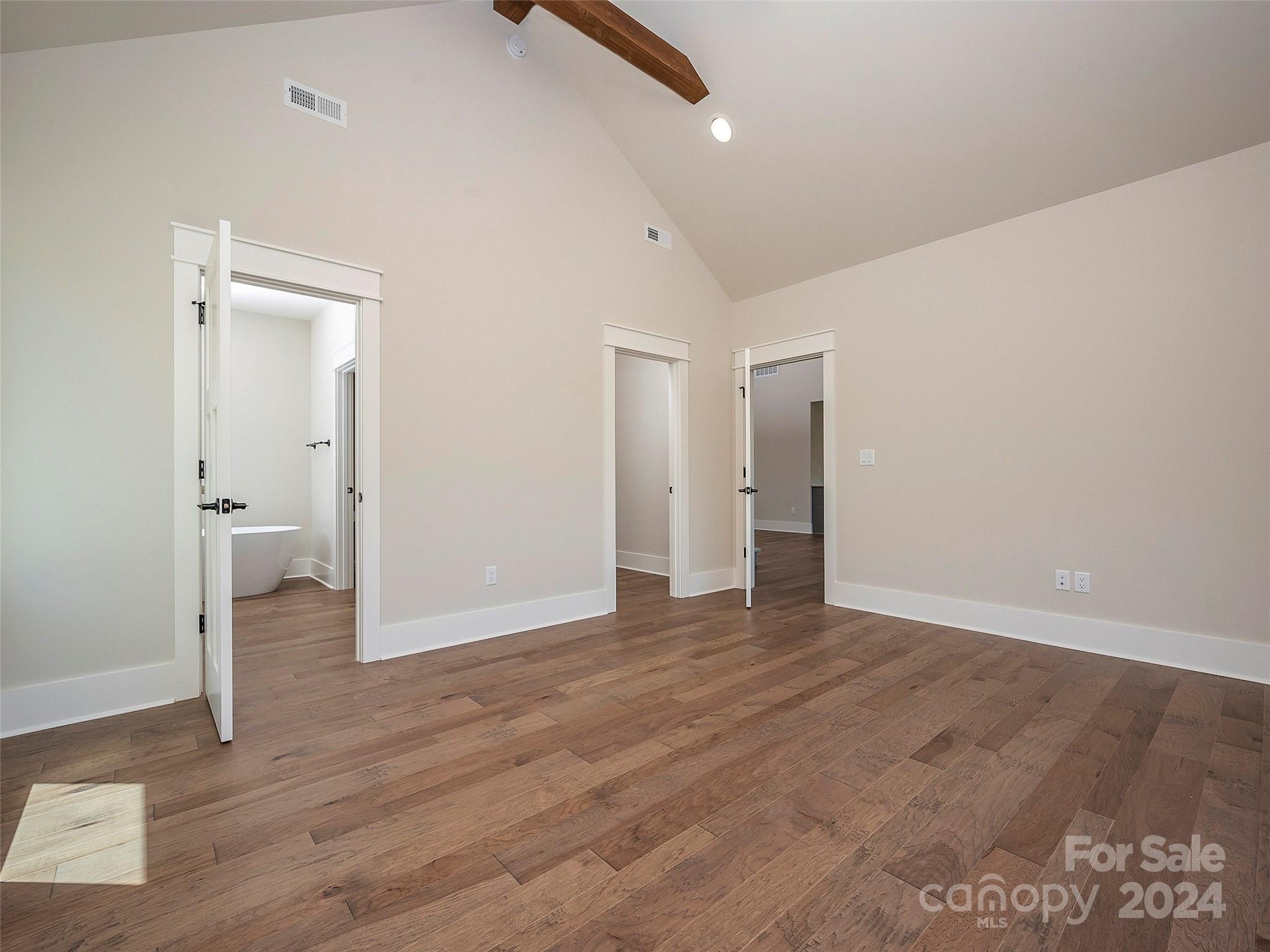 87 Jackson Ridge Ln Mill Spring, Unit 4 Mill Spring, NC 28756 - Photo 30 of 48 wooden floor in an empty room with a window