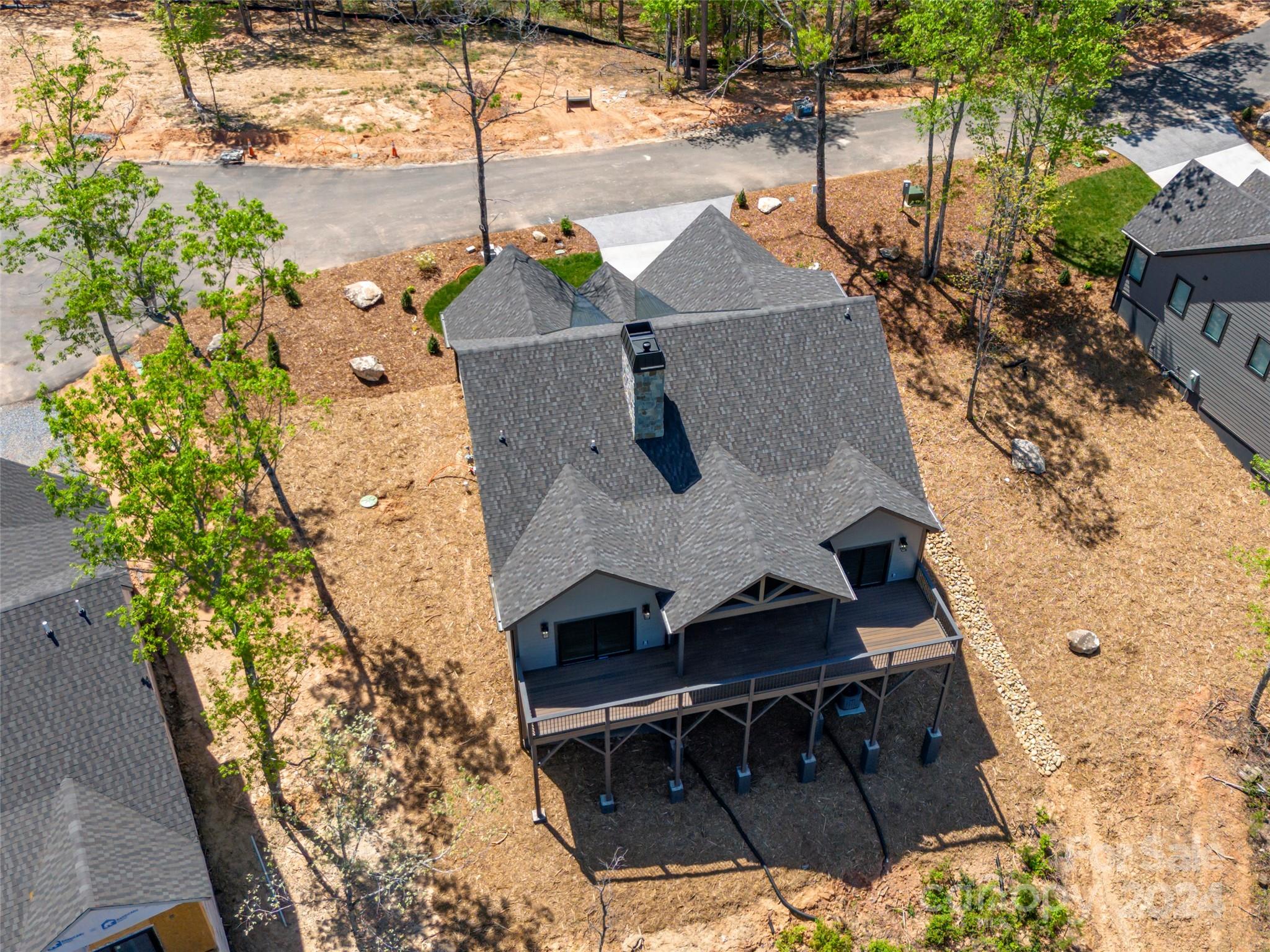 87 Jackson Ridge Ln Mill Spring, Unit 4 Mill Spring, NC 28756 - Photo 48 of 48 an aerial view of a house with a yard
