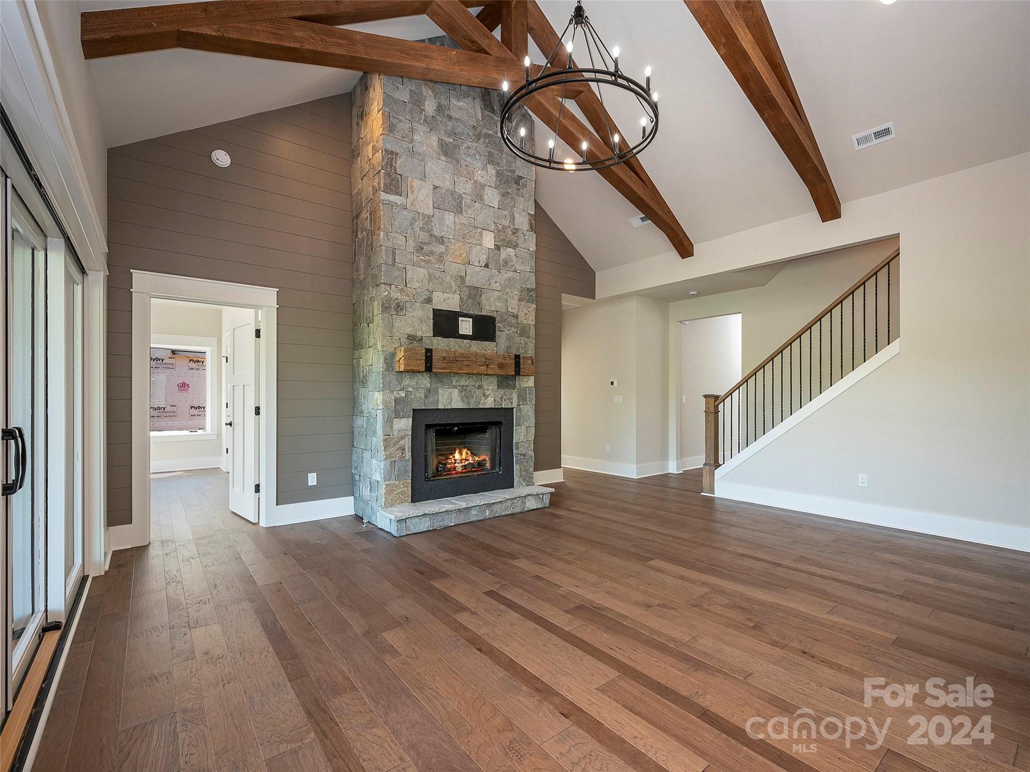 87 Jackson Ridge Ln Mill Spring, Unit 4 Mill Spring, NC 28756 - Photo 7 of 48 a view of a livingroom with wooden floor and a fireplace