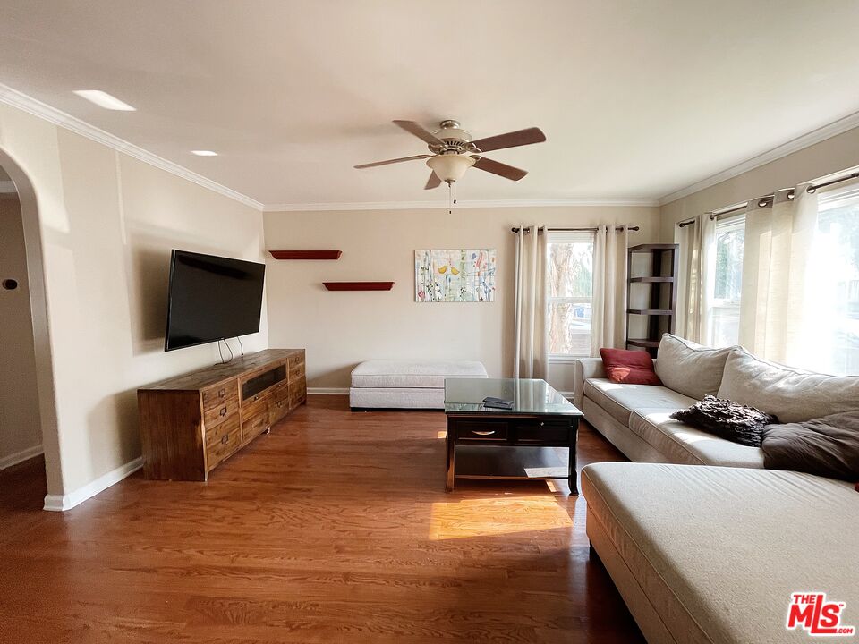 6464 Newcastle Avenue Reseda, CA 91335 - Photo 2 of 17 a living room with furniture and a flat screen tv