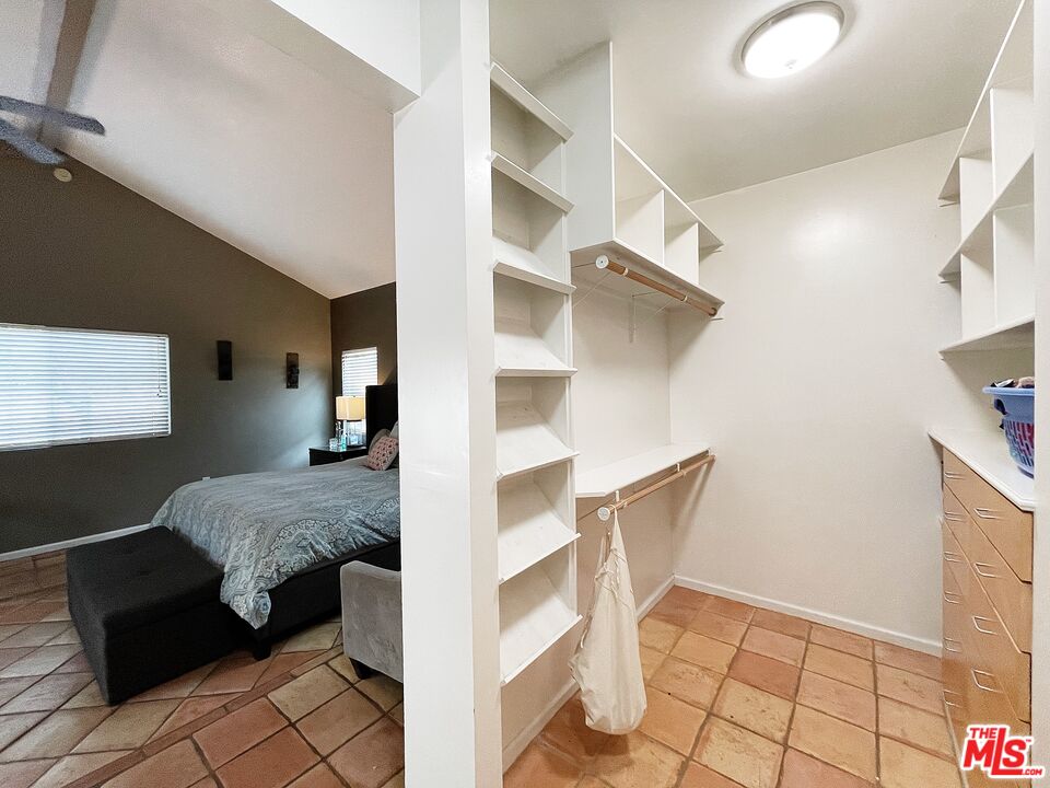 6464 Newcastle Avenue Reseda, CA 91335 - Photo 12 of 17 a view of bedroom with a large window and dresser