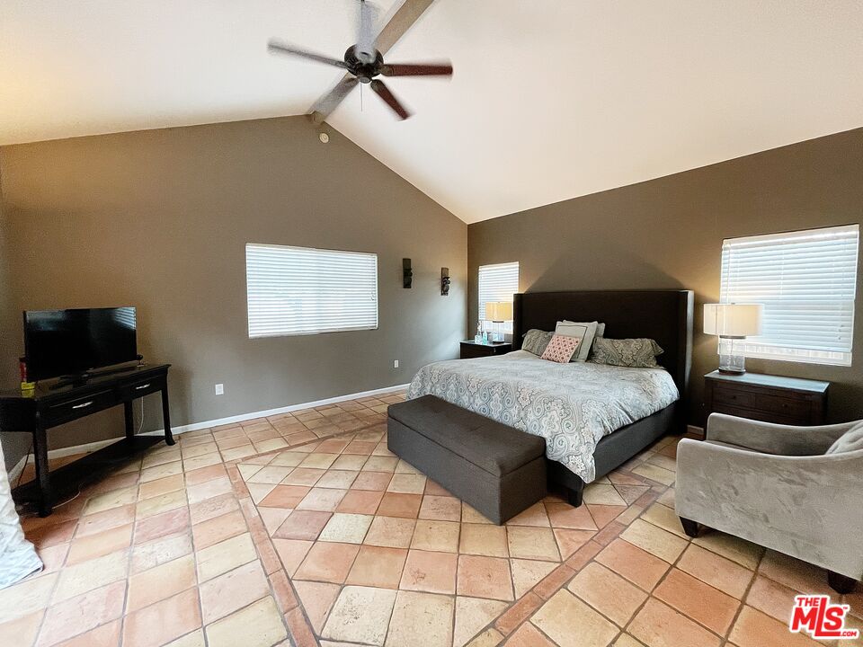 6464 Newcastle Avenue Reseda, CA 91335 - Photo 13 of 17 a bedroom with a bed and wooden floor