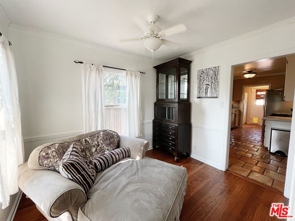 6464 Newcastle Avenue Reseda, CA 91335 - Photo 14 of 17 a living room with furniture and a window