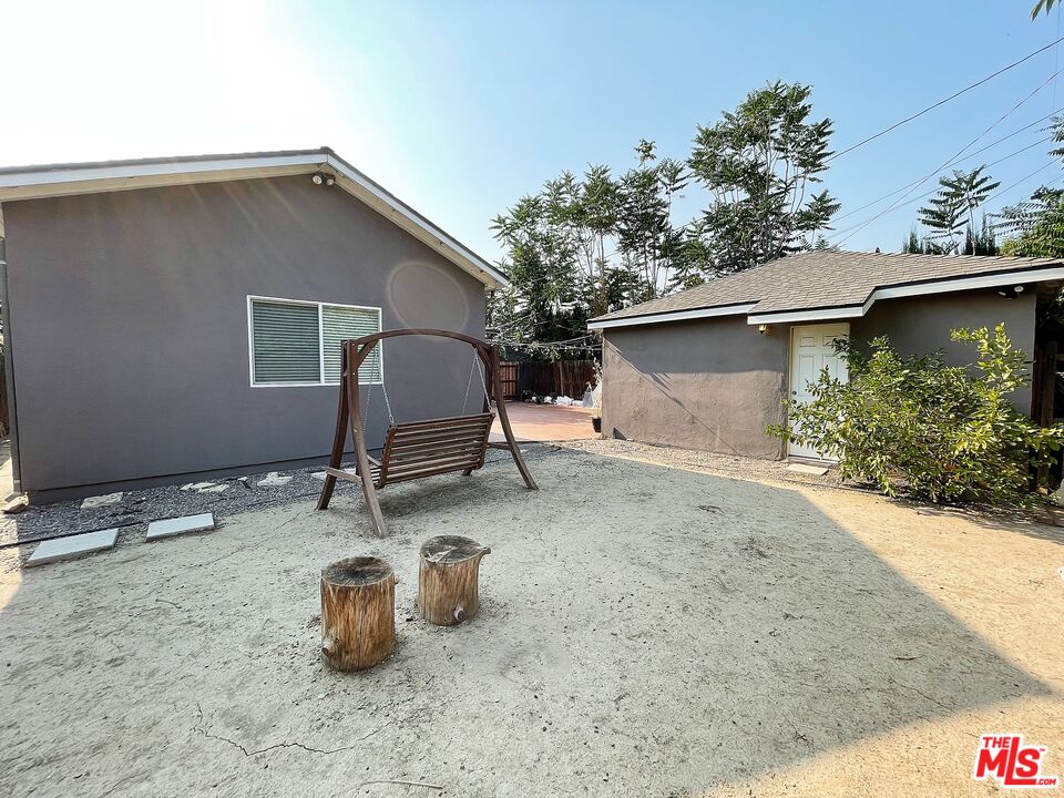6464 Newcastle Avenue Reseda, CA 91335 - Photo 17 of 17 a backyard of a house with table and chairs