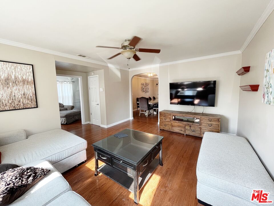 6464 Newcastle Avenue Reseda, CA 91335 - Photo 4 of 17 a living room with furniture and a flat screen tv