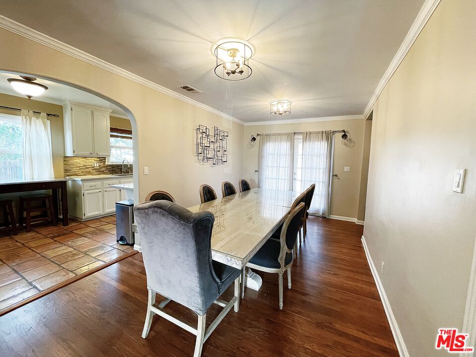 6464 Newcastle Avenue Reseda, CA 91335 - Photo 5 of 17 a view of a dining room with furniture and wooden floor