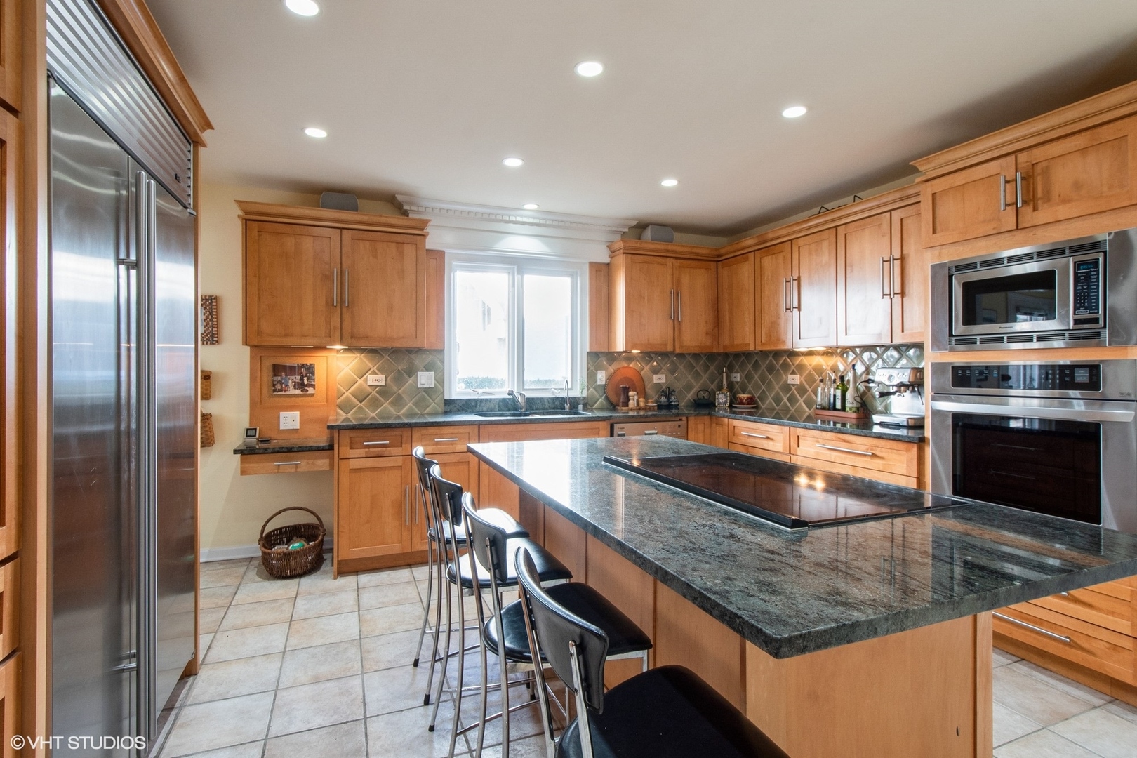 2510 Sheridan Road Evanston, IL 60201 - Photo 4 of 28 a kitchen with a refrigerator a stove a sink and a microwave