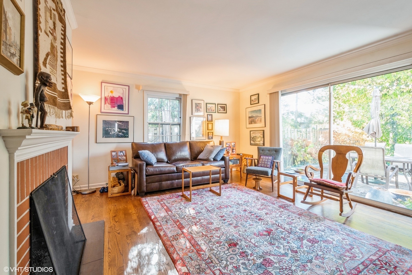 2510 Sheridan Road Evanston, IL 60201 - Photo 7 of 28 a living room with furniture a fireplace and a floor to ceiling window