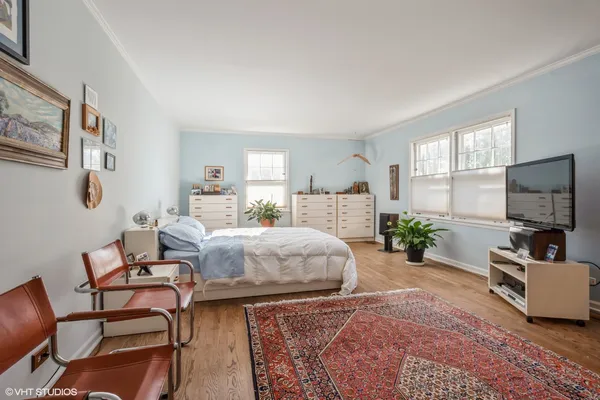 a bedroom with a bed and flat screen tv