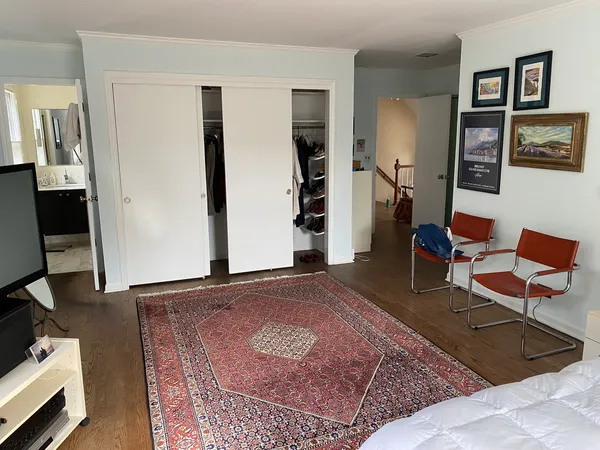 a living room with furniture and a rug