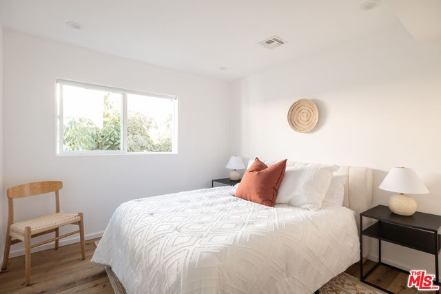 a bedroom with a bed and a table