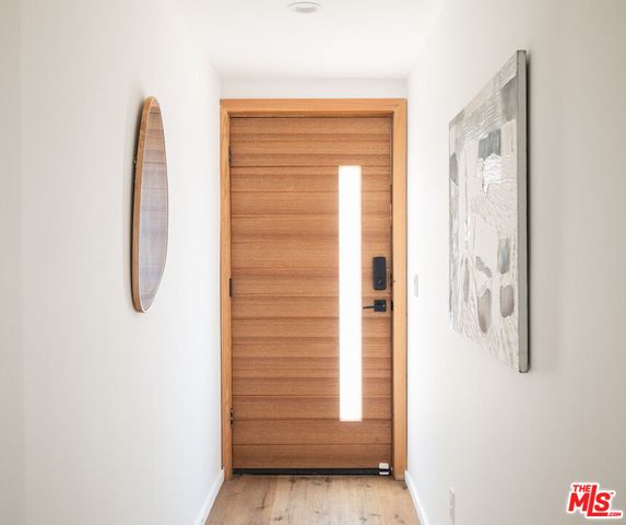 a view of walk in closet with clothes
