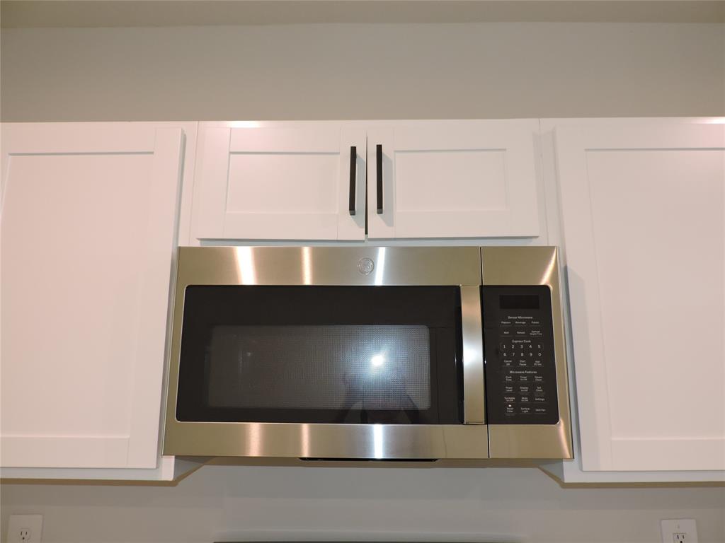 836 Persimmon Place Fort Pierce, FL 34981 - Photo 16 of 78 a fireplace with a clock on wall