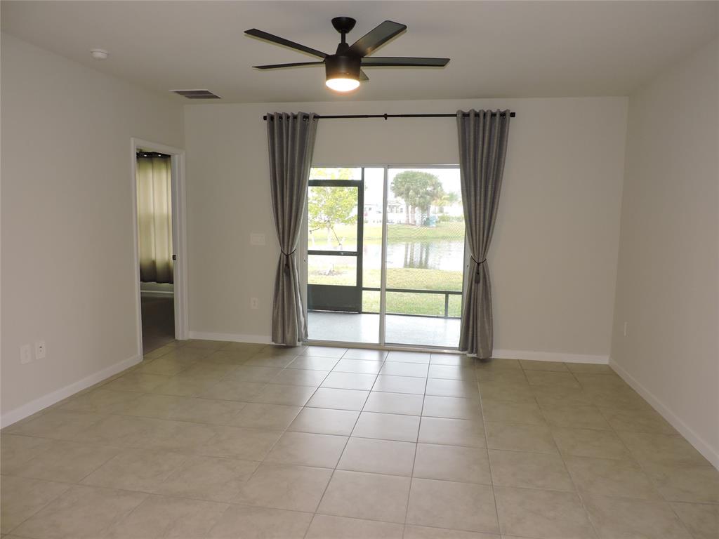 836 Persimmon Place Fort Pierce, FL 34981 - Photo 21 of 78 a view of an empty room with a window