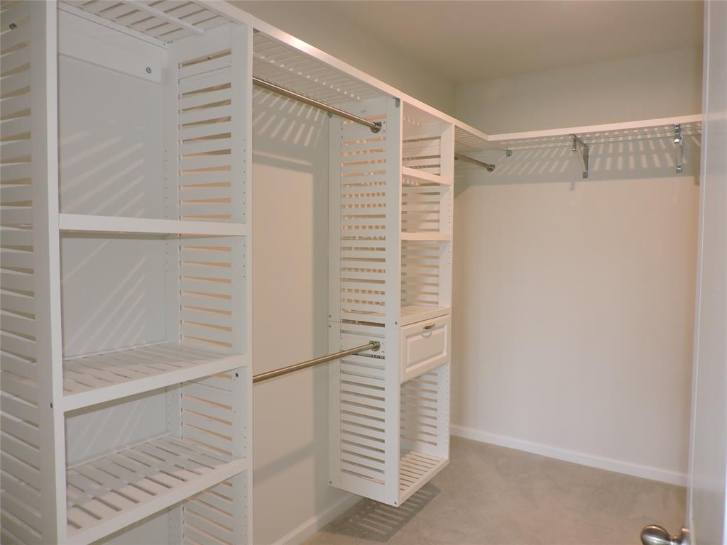 836 Persimmon Place Fort Pierce, FL 34981 - Photo 31 of 78 PRIMARY BEDROOM LARGE WALKIN CLOSET WITH BUILTIN CLOSET SYSTEM