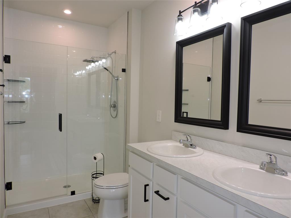 836 Persimmon Place Fort Pierce, FL 34981 - Photo 34 of 78 a bathroom with a double vanity sink mirror and toilet