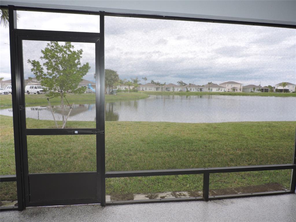 836 Persimmon Place Fort Pierce, FL 34981 - Photo 54 of 78 SCREENED LANAI WITH BEAUTIFUL VIEW OF LAKE