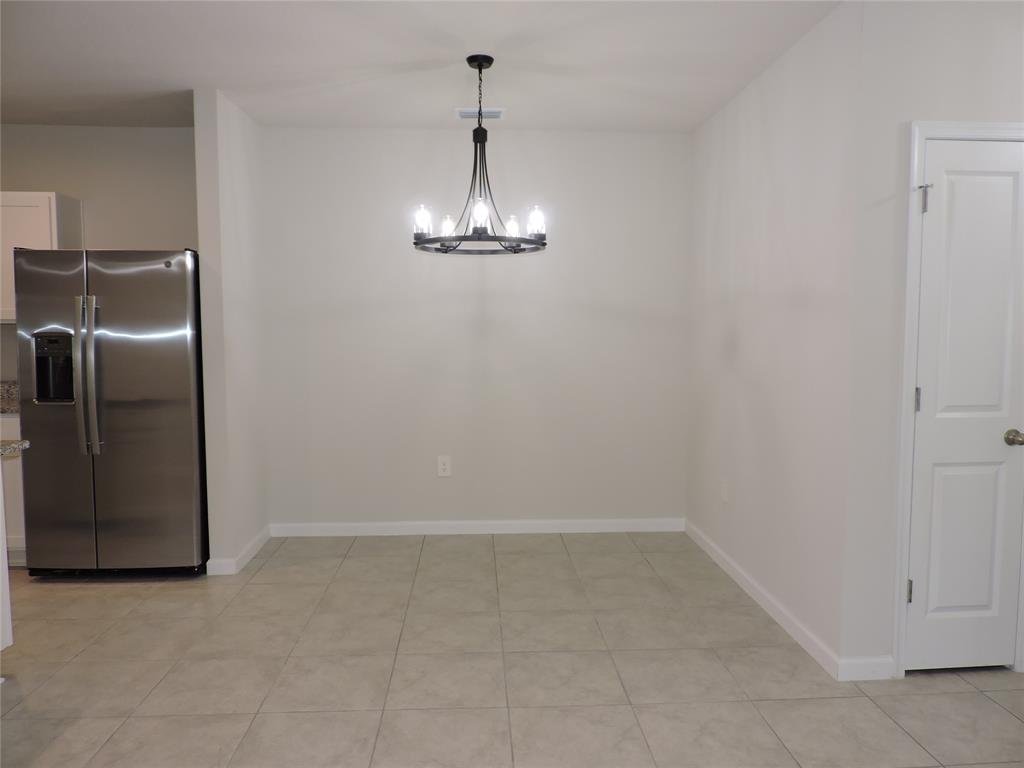 836 Persimmon Place Fort Pierce, FL 34981 - Photo 6 of 78 a view of a livingroom with a chandelier