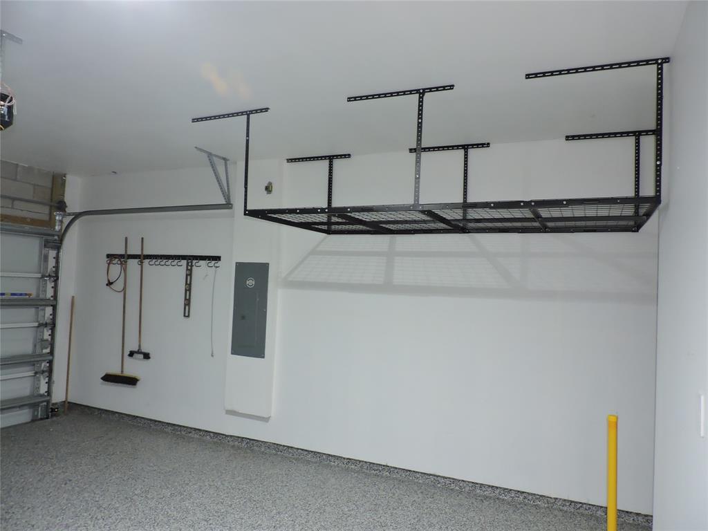 836 Persimmon Place Fort Pierce, FL 34981 - Photo 65 of 78 2 CAR GARAGE WITH HANGING STORAGE