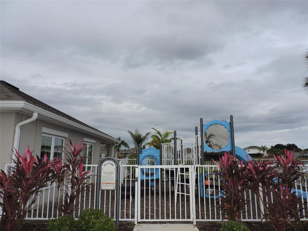 836 Persimmon Place Fort Pierce, FL 34981 - Photo 69 of 78 a view of a house with many windows