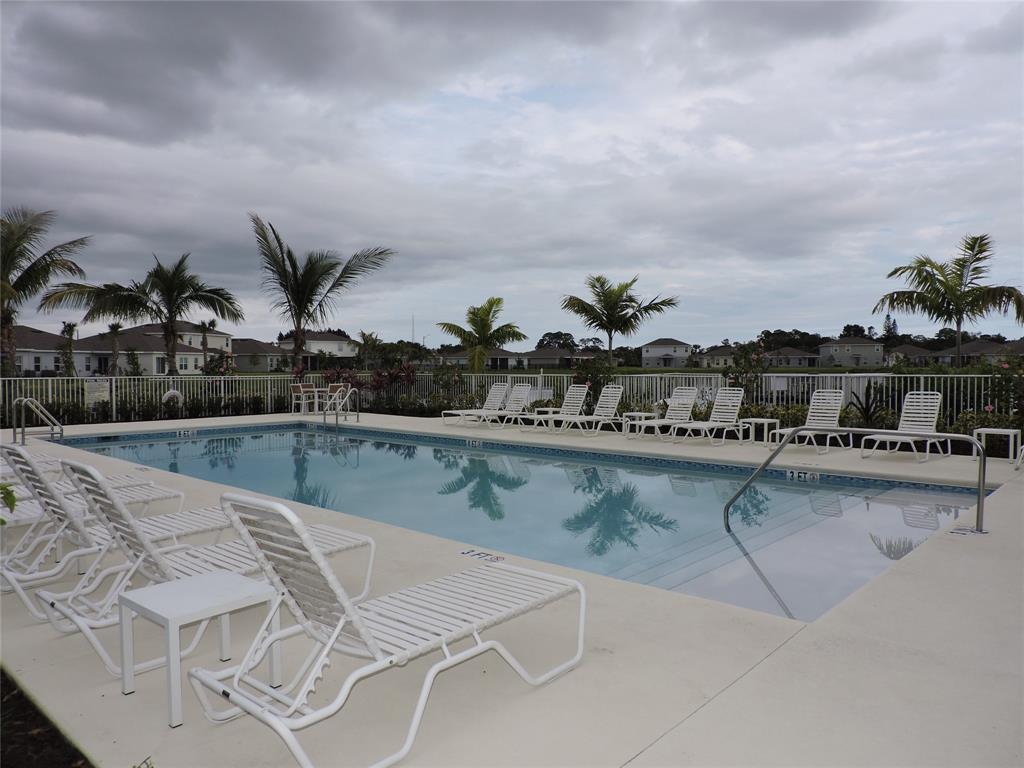836 Persimmon Place Fort Pierce, FL 34981 - Photo 72 of 78 a view of swimming pool with seating area and barbeque oven